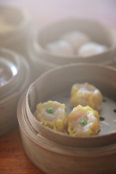 Dim sum , Steam Dumpling in wood basket Chinese food 