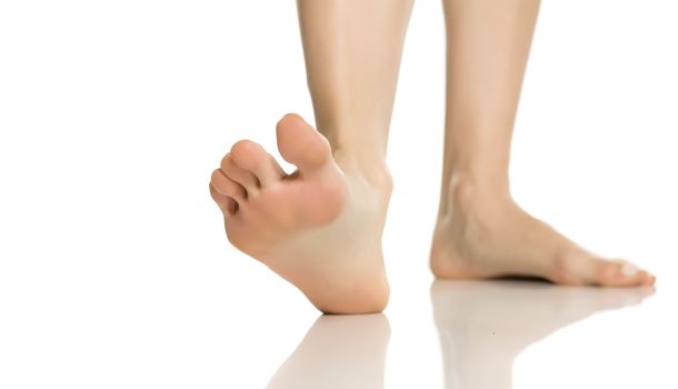 female feet on white background