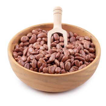 pinto beans in a wooden bowl isolated on a white background