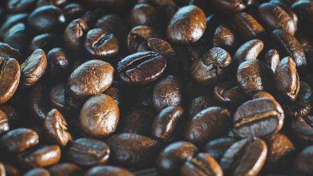 Coffee beans. On a wooden background.