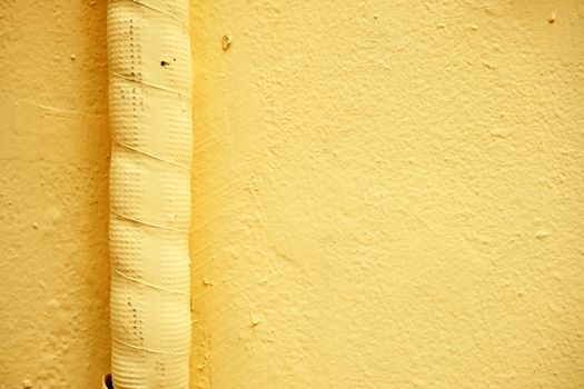 Air Duct on Yellow Paint Concrete Wall.