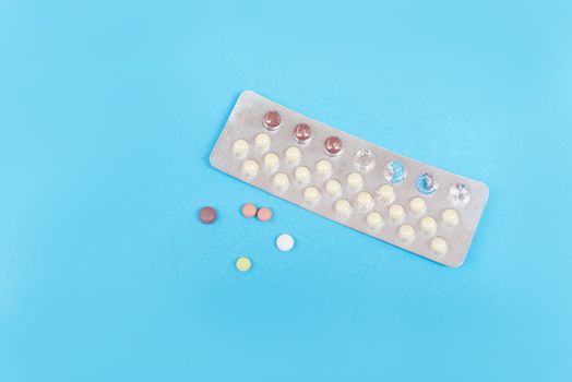 Contraception pills on blue background Birth control contracepti