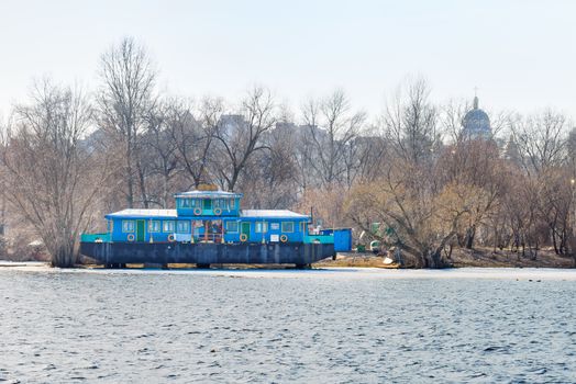 Kiev/Ukraine - Mars 1, 2017 - Blue houseboat on the Dnieper river in Kiev, Ukraine