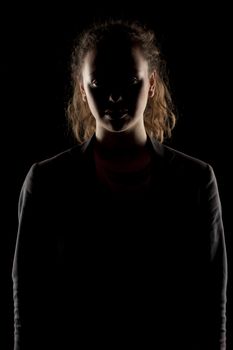 portrait of a girl with the face in shadow