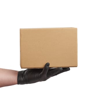 hand in black latex glove holds a cardboard box of brown kraft p