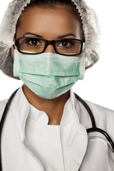 woman doctor with a cap, mask and glasses