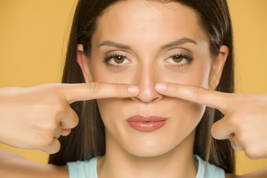 woman touching her nose