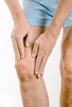 Athlete man feeling pain to the knee and to the quadriceps