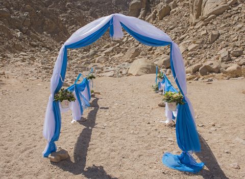 Wedding aisle setup in a remote arid desert environment