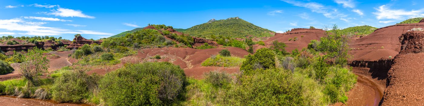 Landscape of canyons and red earth near Lac du Salagou in Hérault in Occitania, France