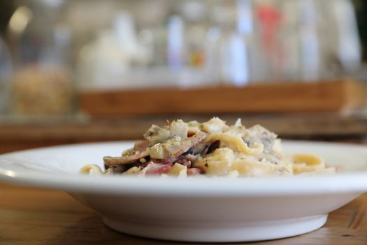 pasta fettuccine alfredo white sauce with ham bacon and mushroom