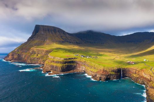 Aerial view of Gasadalur village and its waterfall in Faroe Islands, Denmark