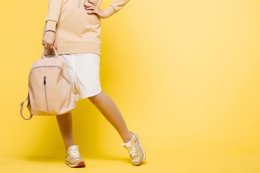 Fashionable and swag look of woman, wearing in beige.