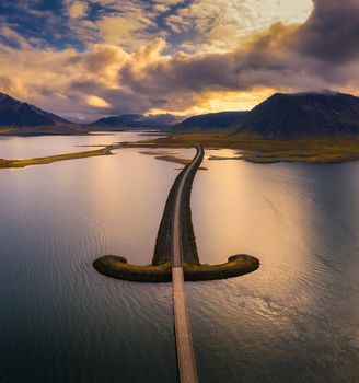 Aerial view of an iconic bridge in west Iceland at sunset