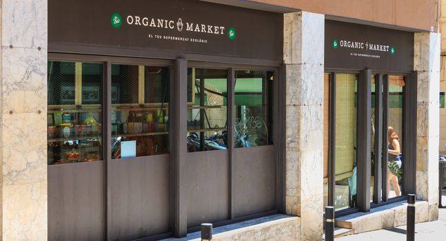 front of a Woki Organic Market in barcelona