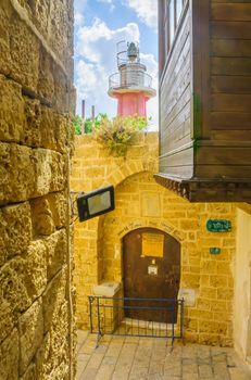 Alley and a lighthouse in the old city of Jaffa