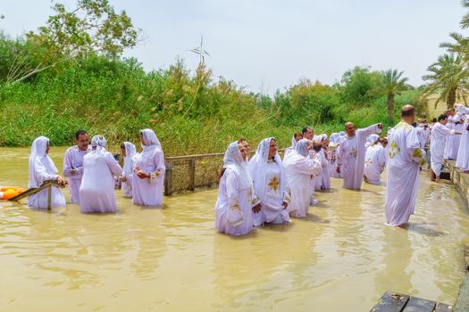 Pilgrims baptize in Qasr el Yahud