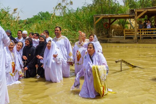 Pilgrims baptize in Qasr el Yahud