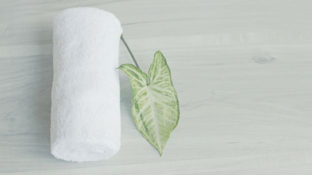Beautifully folded white towels and toiletries.