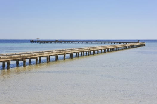 Long jetty over coral reef