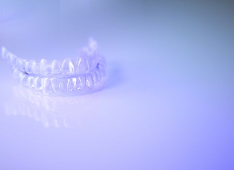 Invisible dental retainers. Correction alignment denture.