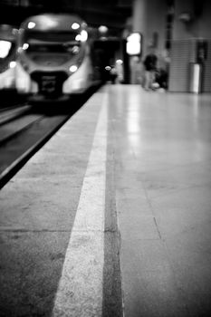 Train station with unfocused train