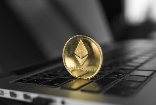 Ethereum coin symbol on laptop, future concept financial currency, crypto currency sign. Blockchain mining. Digital money and virtual cryptocurrency concept. Iinvestment. Bussiness, commercial.
