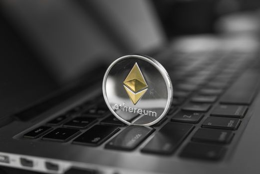 Ethereum coin symbol on laptop, future concept financial currency, crypto currency sign. Blockchain mining. Digital money and virtual cryptocurrency concept. Iinvestment. Bussiness, commercial.