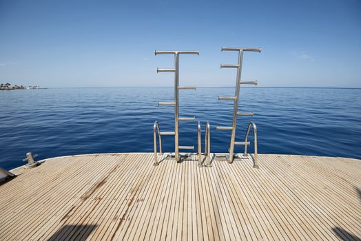 Ladders on the back of a luxury motor yacht
