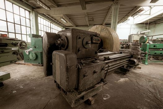 Old lathe machinery in ironworks factory