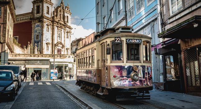 Traditional electric tram flowing through the streets of Porto, 