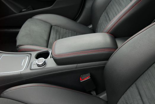 armrest in the luxury passenger car between the front seats