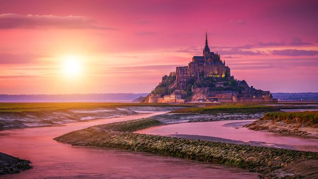 Panoramic view of famous Le Mont Saint-Michel tidal island at su