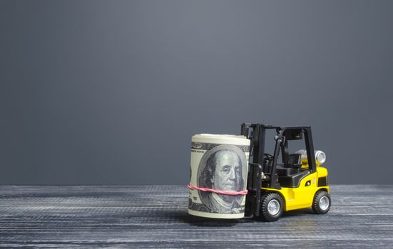 Forklift truck carries a dollars money roll. Making money and increasing capital accumulation. Attraction of investments and financing. High profits, productivity and superprofits. Banking leasing