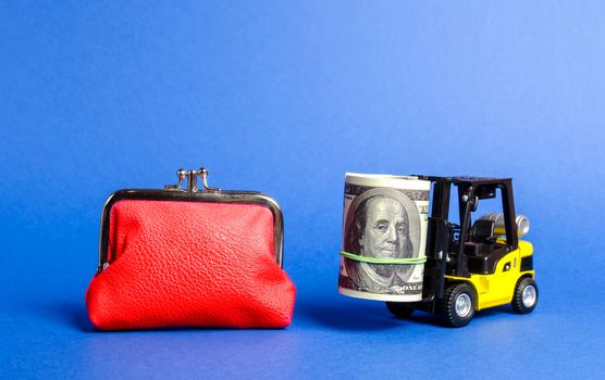 Forklift truck carries a bundle of dollars near a big red wallet. Loan portfolio and investment groups. Savings and deposits on favorable terms. Attracting direct investment in business and production