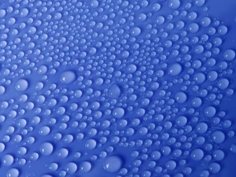 Water drops texture on blue background