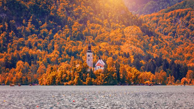 Autumn view on Bled Lake with Pilgrimage Church of the Assumptio