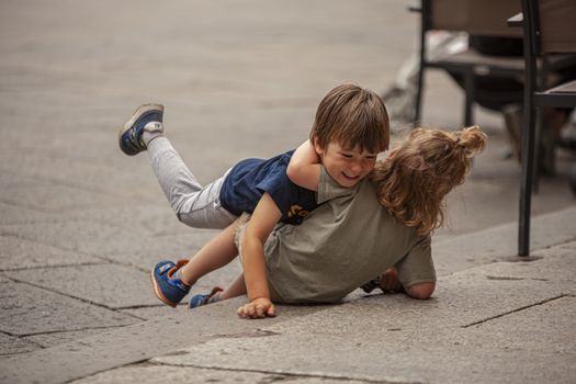 BOLOGNA, ITALY 17 JUNE 2020: Children play on the street