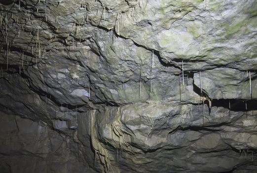 Interior of an underground cave with stalactites