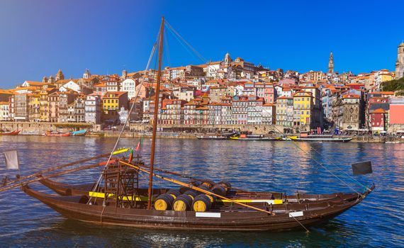 Oporto or Porto city skyline, Douro river, traditional boats and