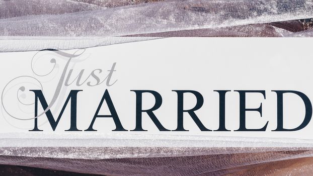 Just Married text on white background with flowers
