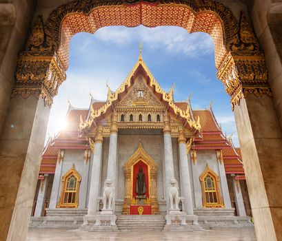 The Marble Temple or Wat Benchamabophit Dusit Wanaram in morning time with sun beam on top of church, famous landmark place for tourist sight seeing in Bangkok Thailand