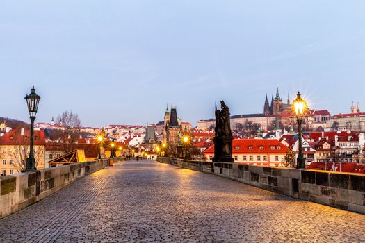 Prague, Czech Republic. Charles Bridge with its statuette and su