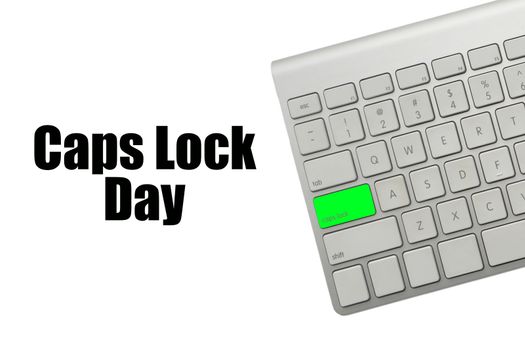 CAPS LOCK DAY text and computer keyboard on white background