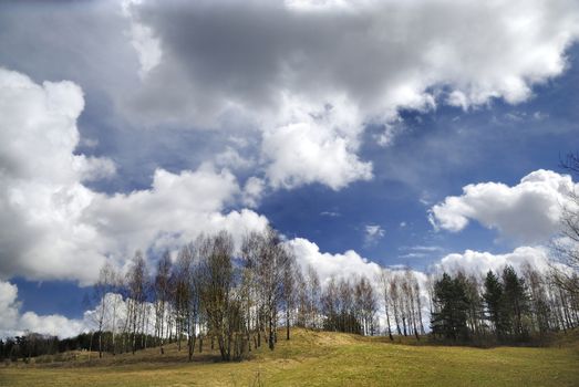 Early spring countryside landscape with beautiful clouds
