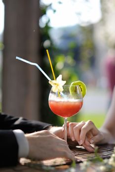 Young couple enjoying exotic drinks