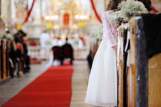 Girl watching a wedding ceremony