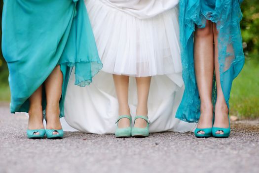 Bride and bridesmaids show off their shoes