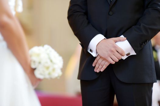 Groom's hands during the wedding ceremony