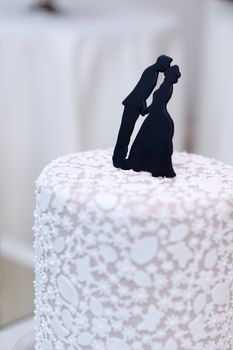 Closeup of wedding cake topper figurines